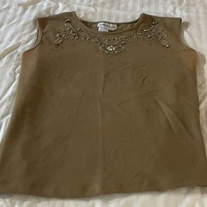 Sleeveless top with sequin decoration at neckline front and back.